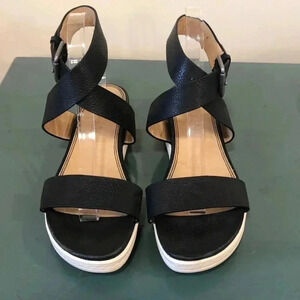 Splendid black leather ankle strap sandals with white rubber soles.